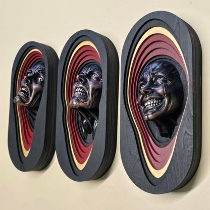 Three hand-painted 3D horror wall art pieces with screaming resin faces set in layered black, deep red and gold plywood frames.
